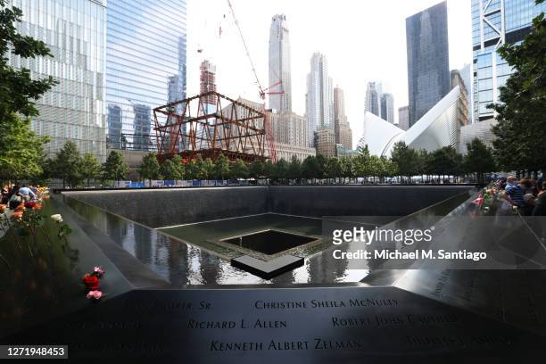 People attend a 9/11 memorial service at the National September 11 Memorial and Museum on September 11, 2020 in New York City. The ceremony to...