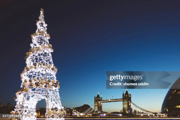 decorated christmas tree against london landmark - christmas travel stock pictures, royalty-free photos & images