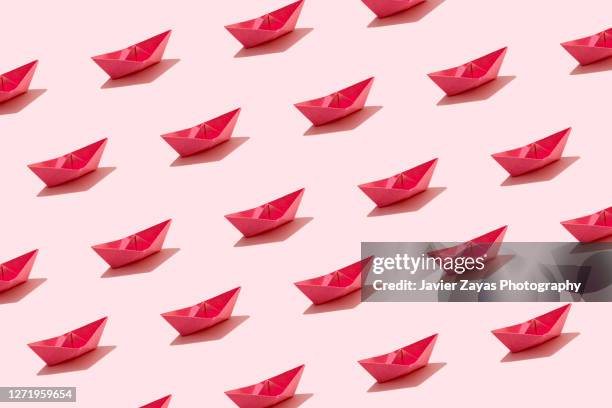 many pink paper boats - paper boat stock-fotos und bilder