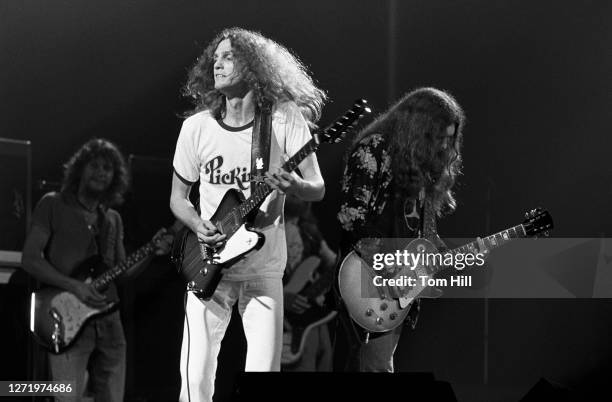 Guitarists Steve Gaines, Allen Collins and Gary Rossington of Lynyrd Skynyrd perform at the Fabulous Fox Theater on July 8, 1976 in Atlanta, Georgia.