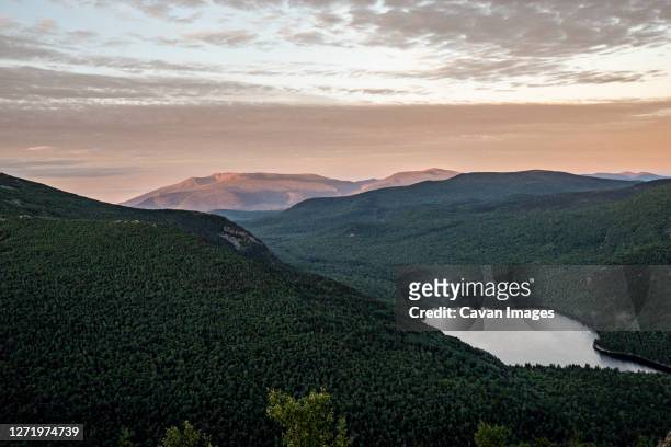 sunrise over the forest and mountains of northern maine, baxter park. - baxter state park stock pictures, royalty-free photos & images