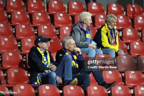 Spectators are seen in the stands prior to the DFB Cup first round match between Eintracht Braunschweig and Hertha BSC at Eintracht-Stadion on...