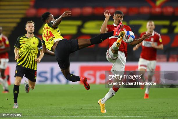 Ashley Fletcher of Middlesbrough and Nathaniel Chalobah of Watford compete for the ball during the Sky Bet Championship match between Watford and...