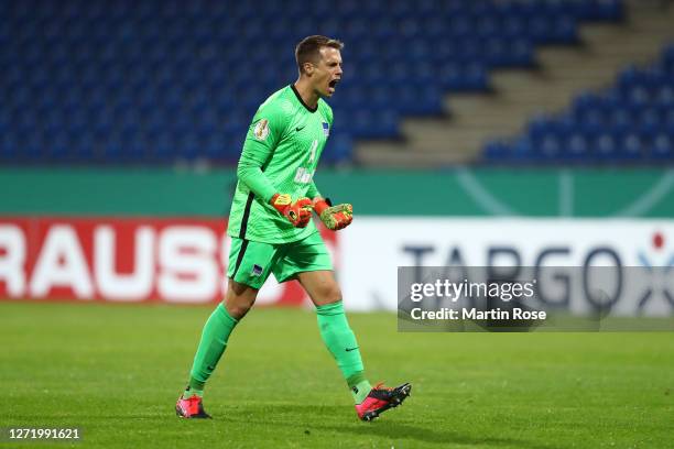 Alexander Schwolow of Hertha Berlin celebrates after his teammate Peter Pekarik of Hertha Berlin scored their sides third goal during the DFB Cup...