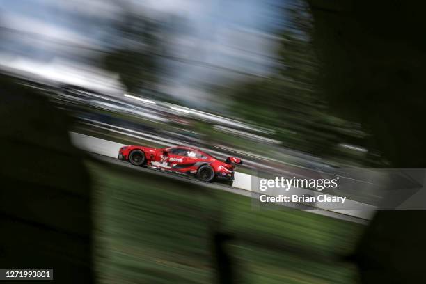 The BMW M8 GTE of Connor de Phillippi and Bruno Spengler, of Canada, races on the track during the Tirerack.com Grand Prix at Michelin Raceway Road...