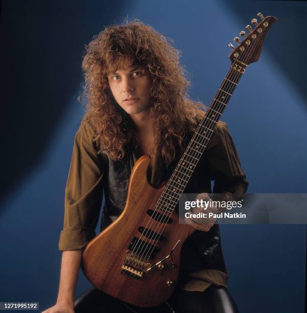 Portrait of American Rock musician Reb Beach, of the group Winger,a s he poses in a photo studio, Chicago, Illinois, March 12, 1989.