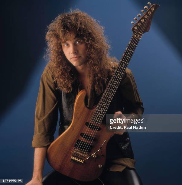 Portrait of American Rock musician Reb Beach, of the group Winger,a s he poses in a photo studio, Chicago, Illinois, March 12, 1989.