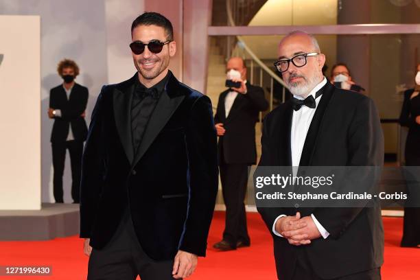 Miguel Ángel Silvestre and Director Álex de la Iglesia walk the red carpet ahead of the movie "30 Monedas" - Episode 1 at the 77th Venice Film...