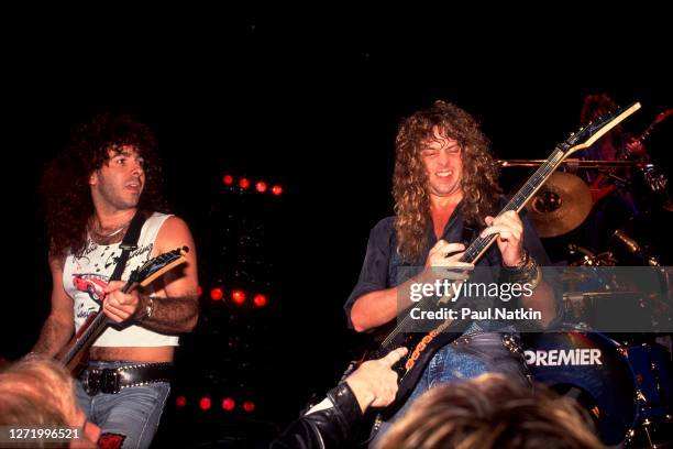 American Rock musicians Paul Taylor and Reb Beach, both of the group Winger, perform onstage at the Poplar Creek Music Theater, Hoffman Estates,...