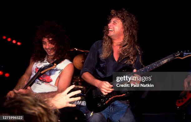 American Rock musicians Paul Taylor and Reb Beach, both of the group Winger, perform onstage at the Poplar Creek Music Theater, Hoffman Estates,...