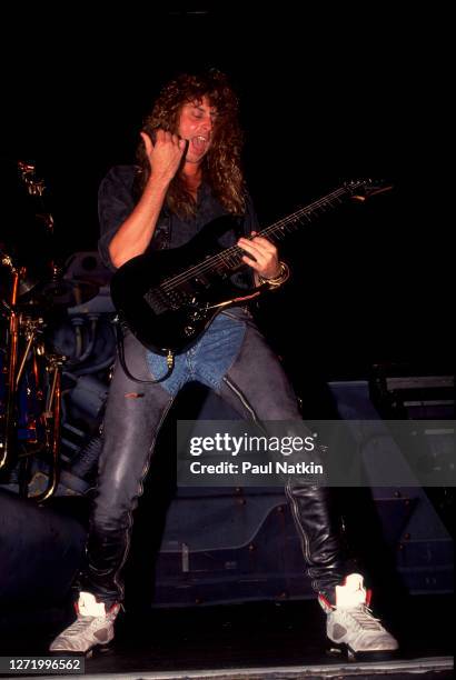 American Rock musician Reb Beach, of the group Winger, performs onstage at the Poplar Creek Music Theater, Hoffman Estates, Illinois, July 27, 1989.