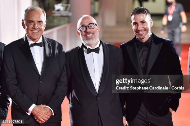 Director of the Festival Alberto Barbera, Director Álex de la Iglesia and Miguel Ángel Silvestre walks the red carpet ahead of the movie "30 Monedas"...