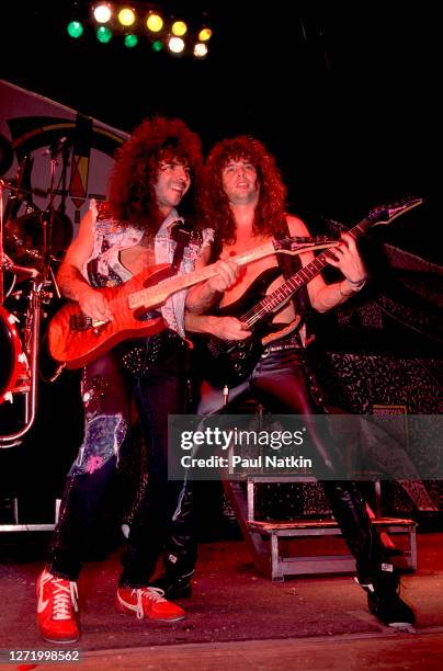 American Rock musicians Paul Taylor and Reb Beach, both of the group Winger, perform onstage at the Alpine Valley Music Theater, East Troy,...