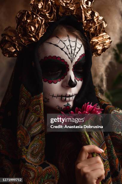 woman's face with ceremonial make-up sugar skull. traditional mexican dia de los muertos celebration - la catrina stock pictures, royalty-free photos & images