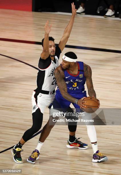 Torrey Craig of the Denver Nuggets drives the ball against Landry Shamet of the LA Clippers during the third quarter in Game Five of the Western...