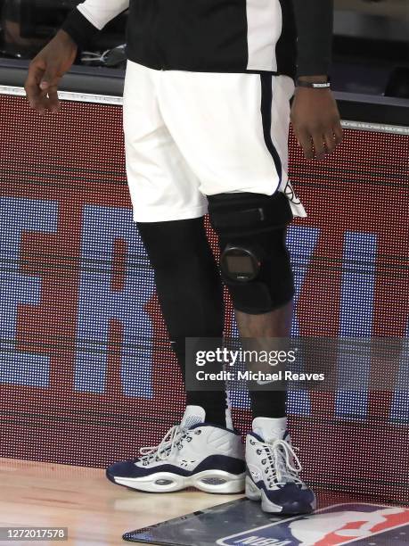 Montrezl Harrell of the LA Clippers uses the Hypervolt Plus on his knee during the third quarter against the Denver Nuggets in Game Five of the...