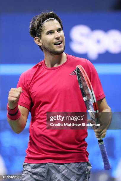 Dominic Thiem of Austria celebrates winning match point during his Men's Singles semifinal match against Daniil Medvedev of Russia on Day Twelve of...
