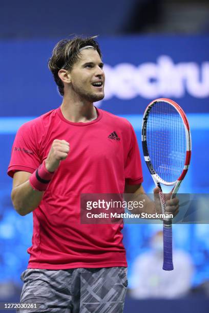 Dominic Thiem of Austria celebrates winning match point during his Men's Singles semifinal match against Daniil Medvedev of Russia on Day Twelve of...