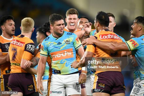 Richard Kennar of the Broncos and Ashley Taylor of the Titans exchanges words during the round 18 NRL match between the Gold Coast Titans and the...