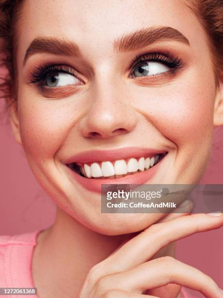 close-up portrait of smiling girl with beautiful make-up - pink colour stock pictures, royalty-free photos & images