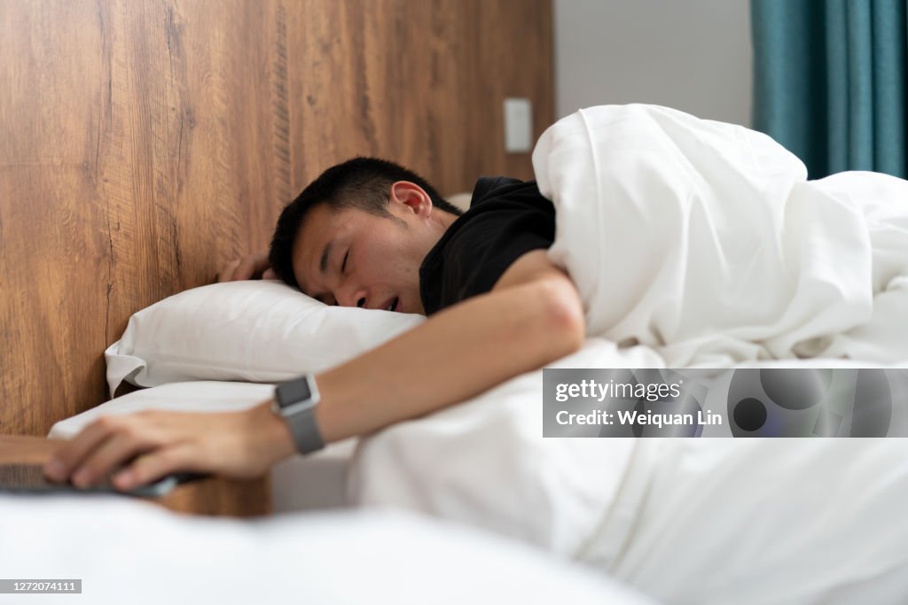 Man sleeping in bed