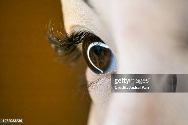 close up of asian women's eyes - the eyes have it stock pictures, royalty-free photos & images