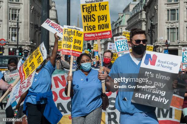 Workers march from the BBC headquarters to Trafalgar square to demand a pay rise from the government on September 12, 2020 in London, England. Nurses...