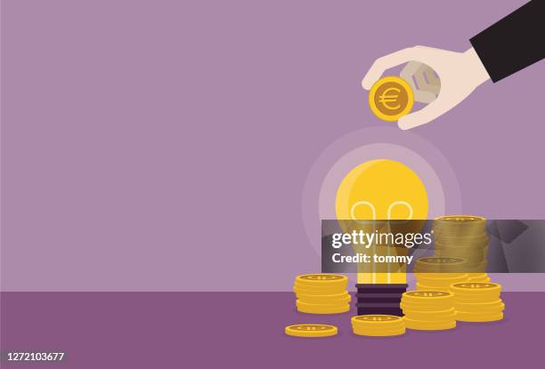 businessman putting a euro coin into a light bulb - european union coin stock illustrations