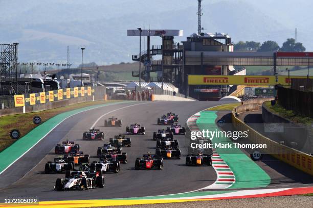 Christian Lundgaard of Denmark and ART Grand Prix leads the field into turn one at the start during the Formula 2 Championship Feature Race at...