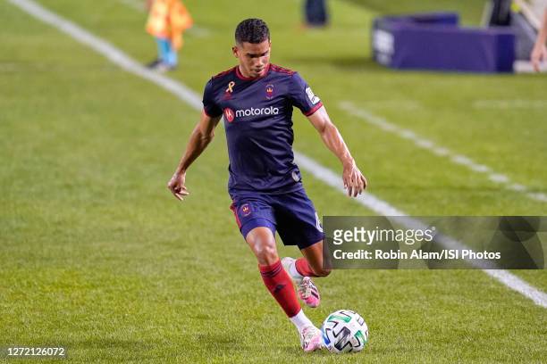 Miguel Angel Navarro of Chicago Fire dribbles the ball during a game between New England Revolution and Chicago Fire at Soldier Field on September...