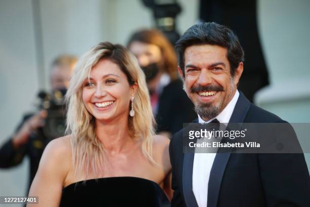 Anna Ferzetti and Pierfrancesco Favino walk the red carpet ahead of closing ceremony at the 77th Venice Film Festival on September 12, 2020 in...
