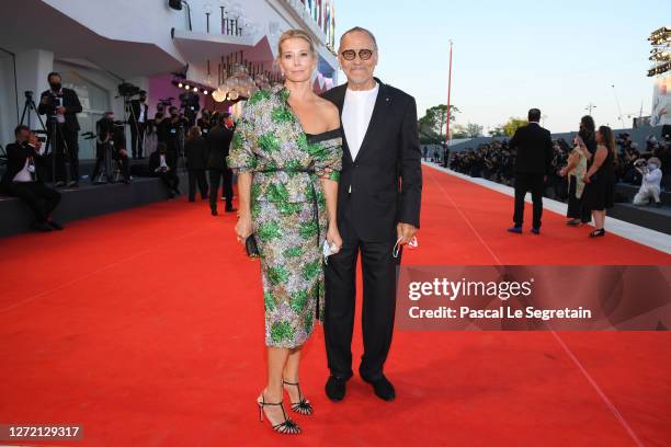 Julia Vysotskaya and Andrej Koncalovskij walk the red carpet ahead of closing ceremony at the 77th Venice Film Festival on September 12, 2020 in...