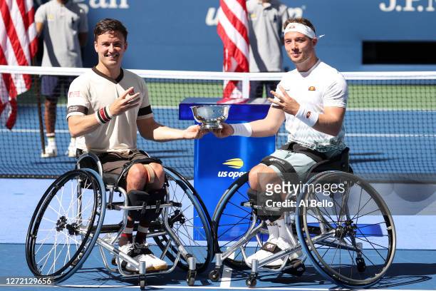 Gordon Reid and Alfie Hewett of Great Britain celebrate with the trophy after winning their Wheelchair Men's Doubles final match against Stephane...