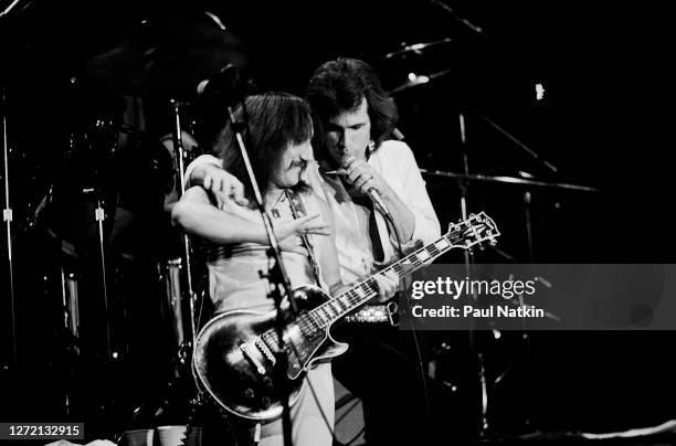 English Rock musicians Mick Box and Peter Goalby, both of the group Uriah Heep, perform onstage at the Park West, Chicago, Illinois, November 29,...