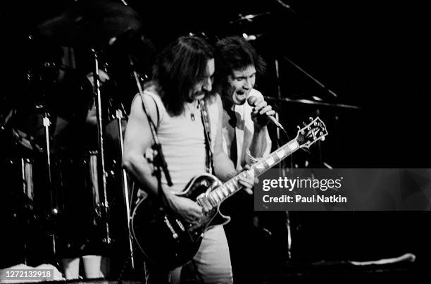 English Rock musicians Mick Box and Peter Goalby, both of the group Uriah Heep, perform onstage at the Park West, Chicago, Illinois, November 29,...