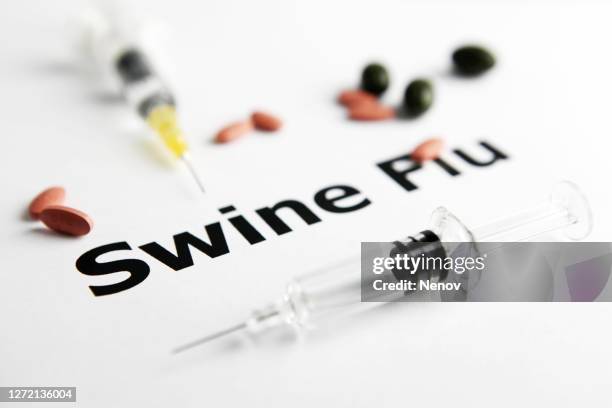 swine flu vaccine with syringe and pills on white background - swine influenza virus stock pictures, royalty-free photos & images