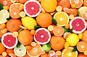 Colorful bright background of fresh ripe sweet citrus fruits