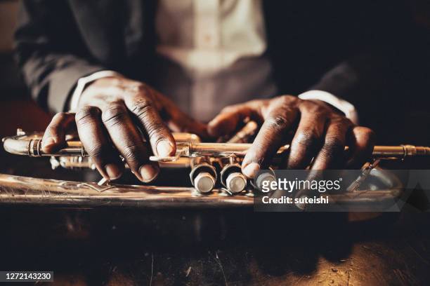 the hands of the trumpet player - musician stock pictures, royalty-free photos & images