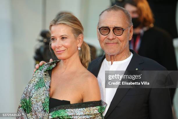 Julia Vysotskaya and Andrej Koncalovskij walk the red carpet ahead of closing ceremony at the 77th Venice Film Festival on September 12, 2020 in...