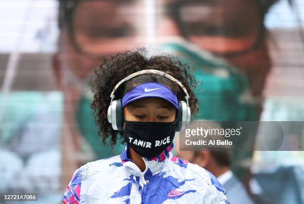 Naomi Osaka of Japan walks on court in front of virtual fans before her Women's Singles final match against Victoria Azarenka of Belarus on Day...