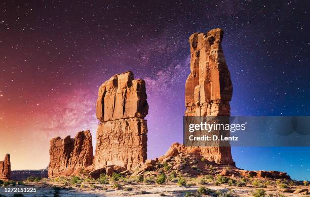 arches national park moab with illuminated starry night sky - utah arch stock pictures, royalty-free photos & images