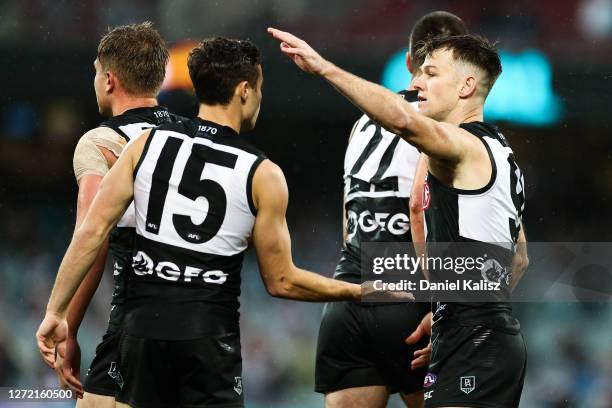 Karl Amon of the Power celebrates with Robbie Gray of the Power during the round 17 AFL match between the Port Adelaide Power and the Essendon...