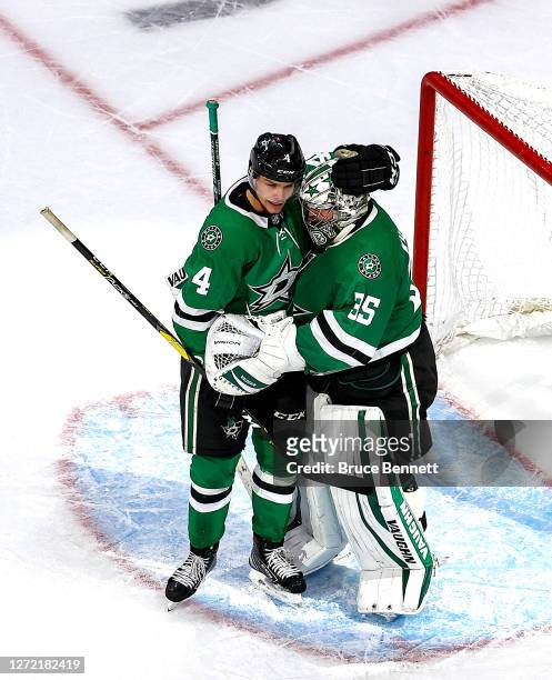 Anton Khudobin and Miro Heiskanen of the Dallas Stars celebrate their teams 2-1 victory against the Vegas Golden Knights in Game Four of the Western...