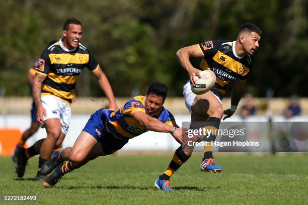 Jacob Rayumaitavuki-Kneepkens of Taranaki is tackled by Matthew Skipwith-Garland of Bay of Plenty during the round 1 Mitre 10 Cup match between the...