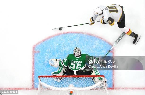 Goaltender Anton Khudobin of the Dallas Stars defends his net against Nicolas Roy of the Vegas Golden Knights in the second period of Game Four of...