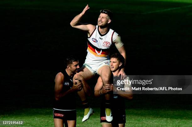 Bryce Gibbs of the Crows is chaired off the field after playing his final match during the round 17 AFL match between the Carlton Blues and the...