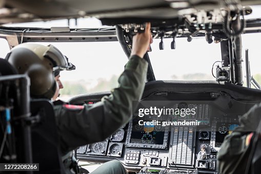 Army Pilot Riding Military Helicopter