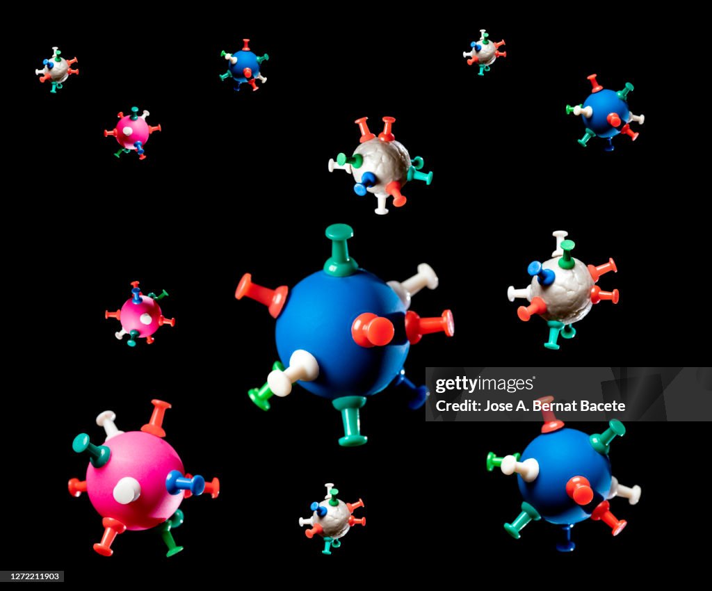 Coronavirus covid-19 floating in the air on a black background.