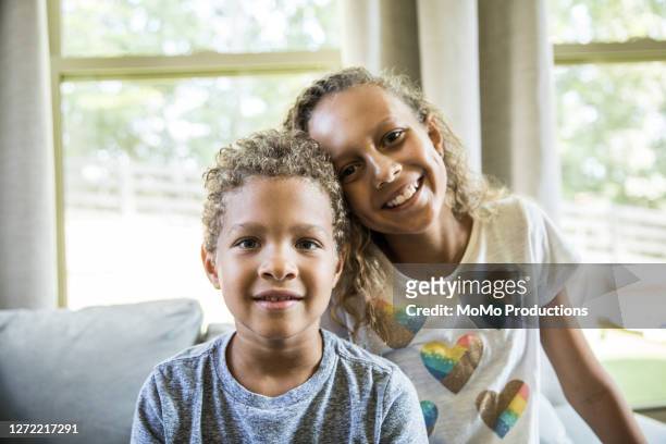 portrait of brother and sister at home - brother stock pictures, royalty-free photos & images