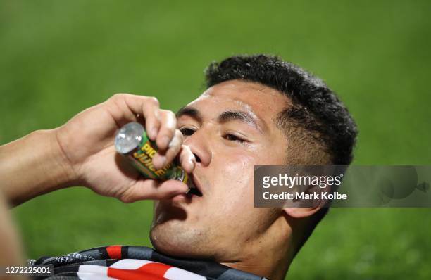 Roger Tuivasa-Sheck of the Warriors drinks pickle juice during the round 18 NRL match between the Cronulla Sharks and the New Zealand Warriors at...